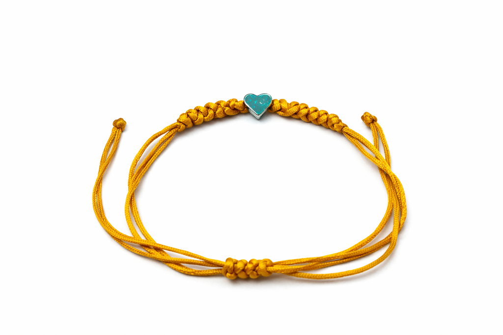 Pulsera ajustable con corazón plateado/dorado