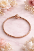 Pulsera tono oro rosa